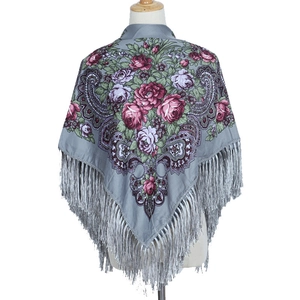Detailed view of vintage floral print shawl with pink roses and elegant grey fringe