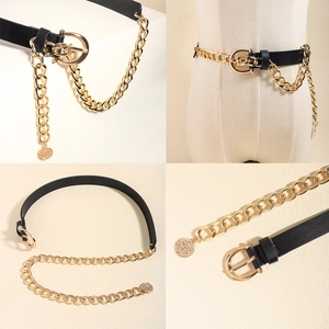 Detail of black leather belt with chunky gold chain and vintage coin pendant