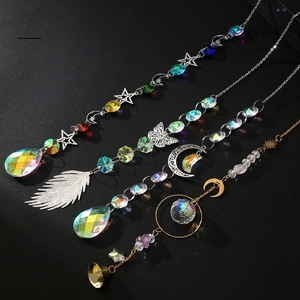 Set of 4 sun catchers featuring star, moon, butterfly, and feather crystals with metal bells