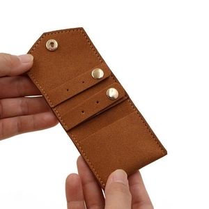 Brown faux leather travel jewelry organizer bag for earrings and rings with metal snaps