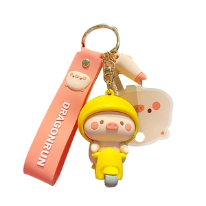 Cute cartoon pig keychain with pink strap and yellow motorcycle piglet pendant