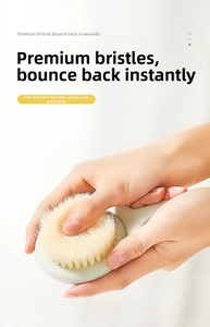 Detail of soft yellow bristles on bath brush showing elastic rebound and skin-friendly texture