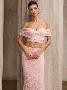 Close-up of pink lace off-shoulder crop top and high waist bodycon skirt set