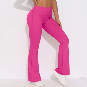 Detailed view of high-waisted rose red yoga pants with flared cuffs and ergonomic seams