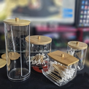 Detailed set of four clear acrylic organizers with bamboo lids for cotton swabs