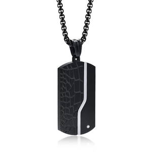 Detail of black military pendant necklace with crocodile texture and embedded diamond