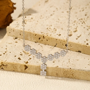 S925 sterling silver Y-shaped floral necklace with sparkling cubic zirconia on stone tiles