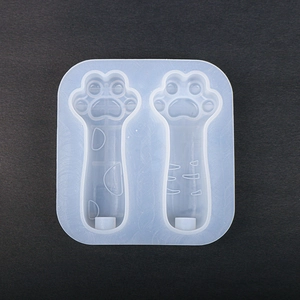 Détail du moule en silicone double patte de chat pour résine sur fond noir