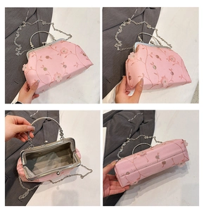Pink floral embroidery handbag details showing internal structure and metallic handle
