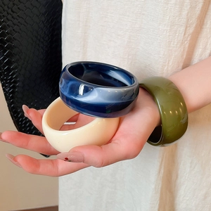 Three-piece stackable wide acrylic bangles set in marbled blue, cream white and olive green