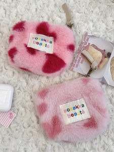 Cute pink cow print plush coin purse and earphone storage bag with zipper closure