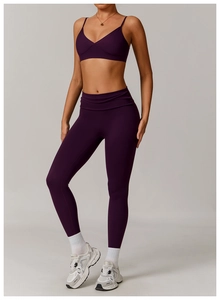 Deep purple high-waist yoga set featuring a V-neck sports bra and matte stretch leggings