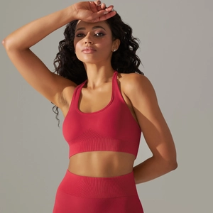 Detailed close-up of seamless ribbed fabric on dark rose red high-waisted yoga set