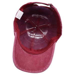 Inside view of burgundy cotton baseball cap showing adjustable strap and inner structure