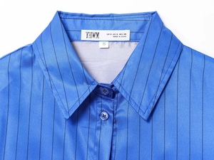 Detail of blue striped shirt collar showing S size label and fine woven fabric texture