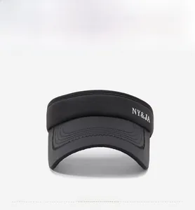 Detailed front view of black sun visor hat featuring white NY and JA letter embroidery