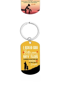 Detailed view of stainless steel keychains with colorful parent-child silhouettes and quotes