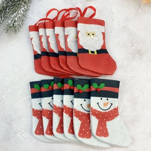 Detailed flat lay of twelve Christmas mini stockings featuring Santa and Snowman designs