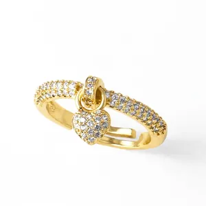 Gold plated adjustable open ring featuring a dangling heart charm and pavé zircon stones