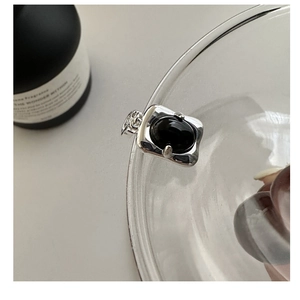 S925 silver necklace pendant with oval black onyx gemstone on glass bottle rim
