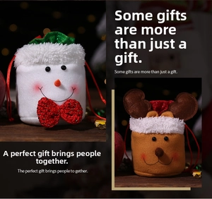 Detailed view of plush Christmas drawstring gift bags featuring snowman and reindeer designs