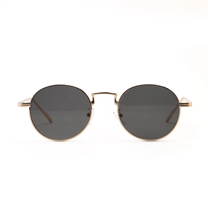 Vintage round metal frame sunglasses with gold finish and dark grey tinted lenses