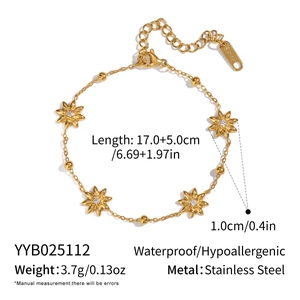 Detail view of starburst charm bracelet in gold stainless steel with product dimensions