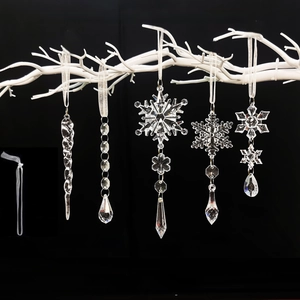 Close-up of 18-piece set featuring transparent crystal snowflakes and icicle ornaments