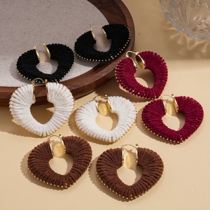 Set of four heart-shaped yarn-wrapped hoop earrings in black, white, burgundy, and brown