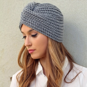 Detailed close-up of grey cable knit turban hat with stylish front knot design