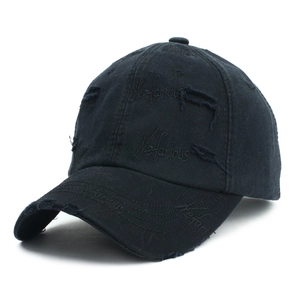Close-up of black distressed cotton baseball cap featuring Nefarious embroidery details
