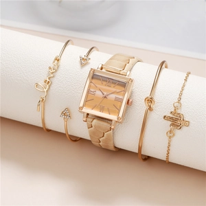 Detail of gold square watch with Roman numerals and matching charm bracelet set