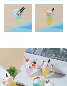 Detailed view of colorful artificial sundae cups with faux cream toppings and fruit garnishes