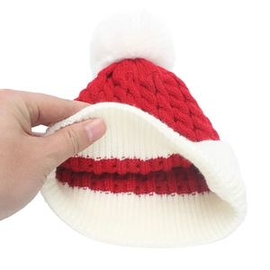 Thick red and white knit Christmas hat with pompom and warm double-layer lining