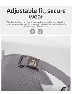 Close-up of adjustable metal buckle and twill fabric texture on a grey baseball cap