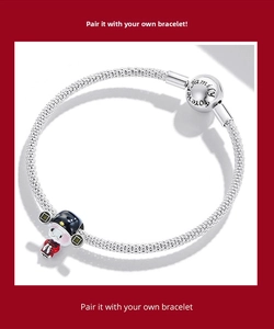 Close-up of silver snake chain bracelet with family forever clasp and lucky doll charm