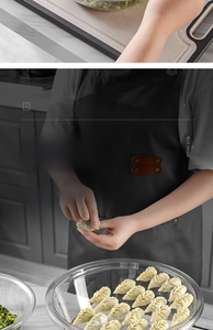 Detail of transparent dough basin lid used as a tray for dumplings in kitchen
