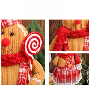 Detail of gingerbread man plush doll with ribbed texture and festive red outfit