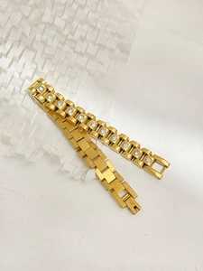 Detail of 18K gold-plated stainless steel watch chain bracelet with white crystal inlays