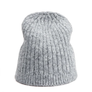 Detailed view of light grey knit beanie texture with thick ribbed wool blend stitching