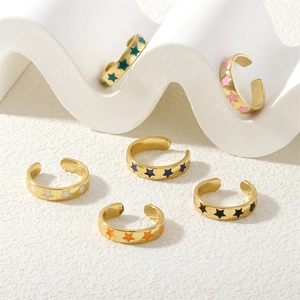 Set of 6 adjustable star rings in various candy colors with gold plated finish