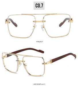Detail view of gold metal double bridge frames and reddish-brown wood grain temples