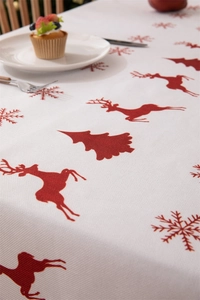 Close-up of waterproof polyester tablecloth with red reindeer and snowflake prints