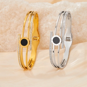 Gold and silver stainless steel bangles with roman numerals and sparkling zircons