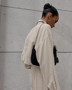 Detail view of beige linen-texture long sleeve shirt and matching drawstring pants set
