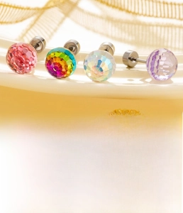 Detail of titanium steel stud earrings with 4mm faceted crystal beads in multiple colors