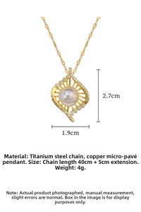 Detailed close-up of bird nest necklace with white pearl and sparkling zircon inlay