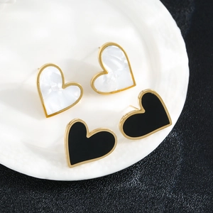 Elegant gold titanium steel heart stud earrings set in black and white mother of pearl