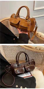 Close-up of gloss leather saddle bag with dual pockets and silver zippers