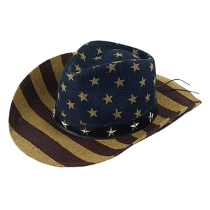 Detail of straw cowboy hat with American flag stars, stripes and leather star-studded band